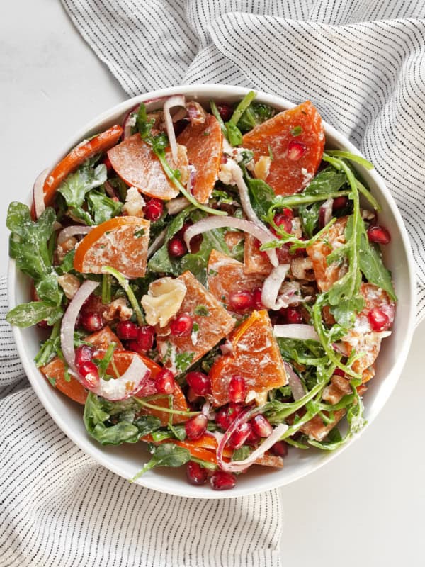 Persimmon salad in a bowl.