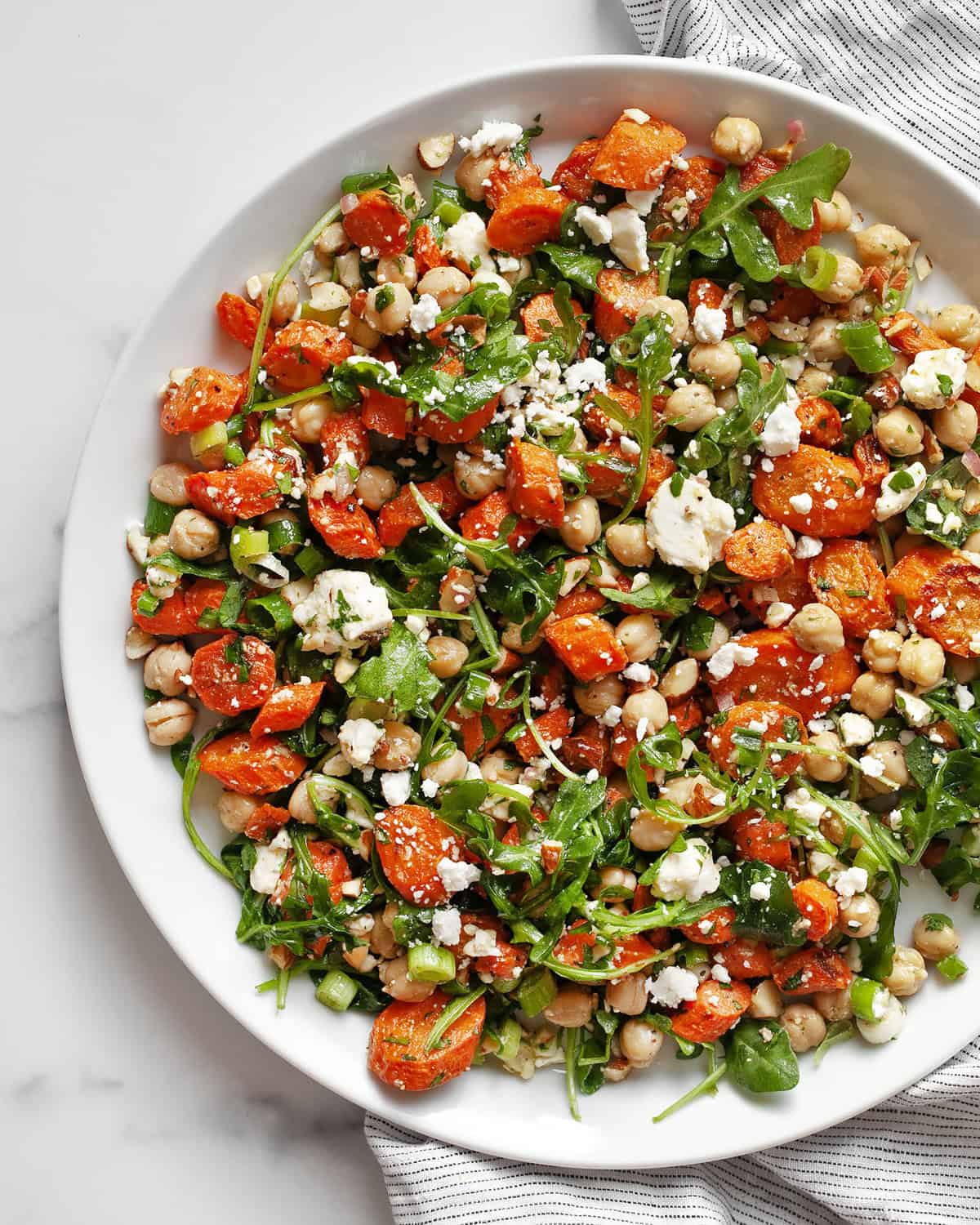 Roasted carrot salad with chickpeas on a plate.