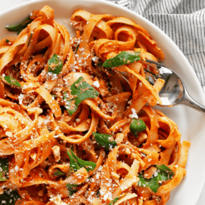 Creamy sun dried tomato pasta on a plate.