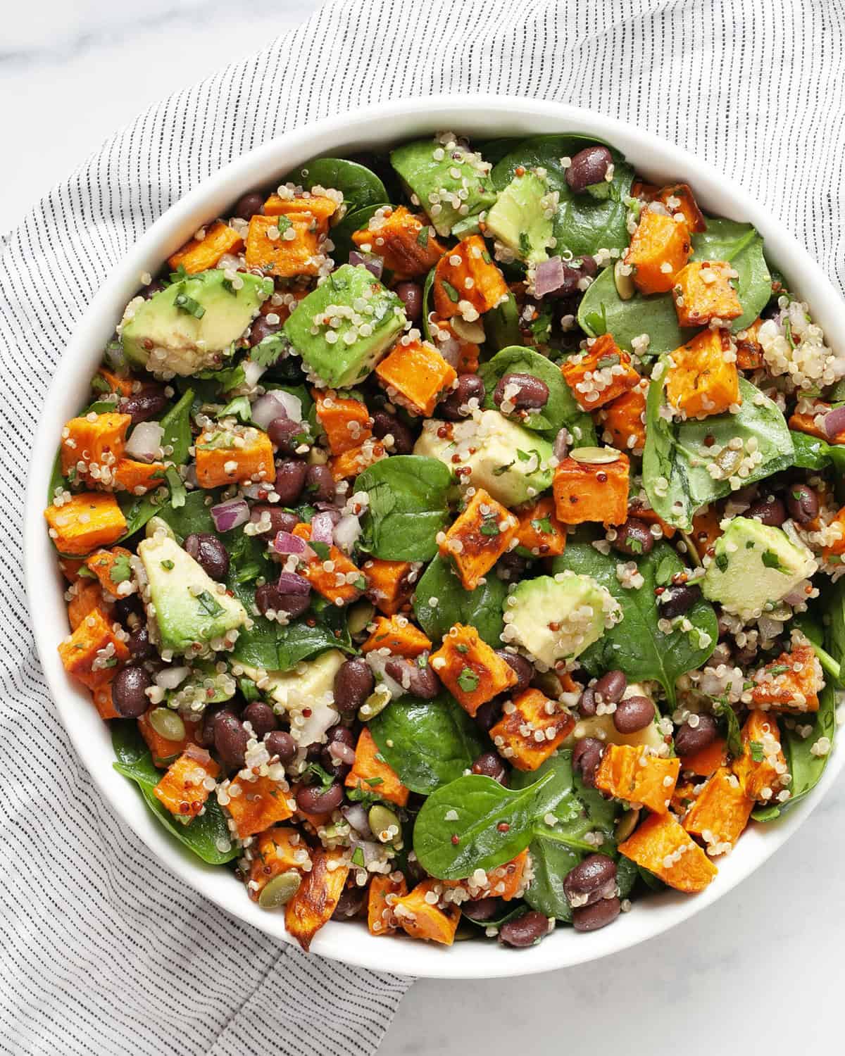 Roasted sweet potato black bean salad in a bowl.