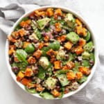 Sweet potato salad with black beans, quinoa and avocados in a bowl.