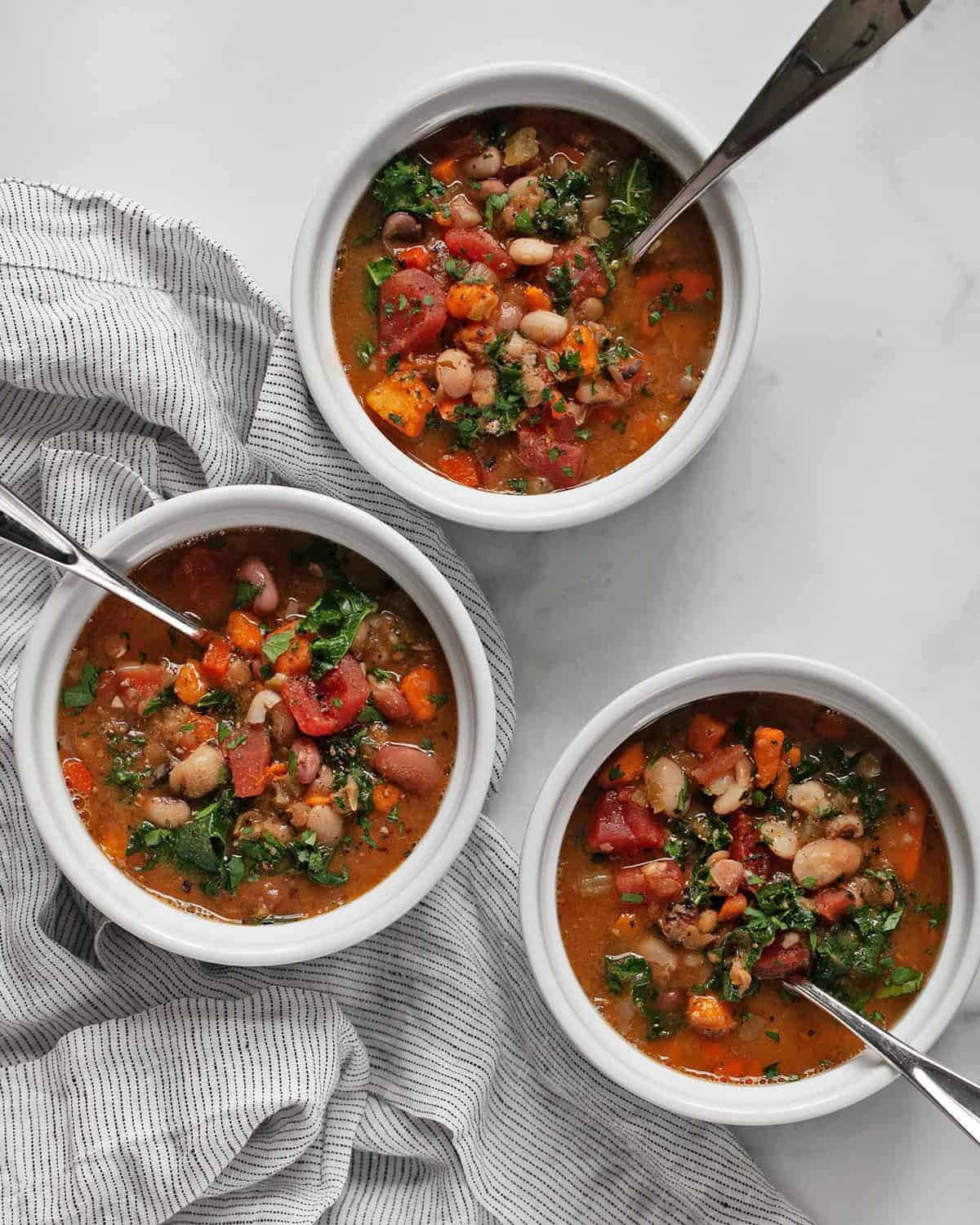 Three bowls of slow cooker 15 bean soup.