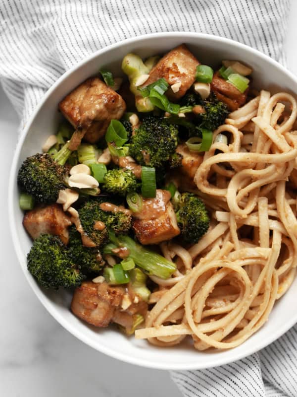 Roasted broccoli tofu bowl with peanut noodles.