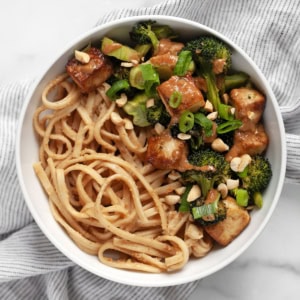 Roasted broccoli tofu bowl with peanut noodles.