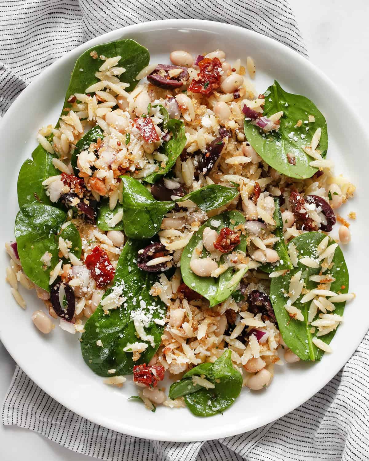 Lemon orzo pasta salad on a plate.