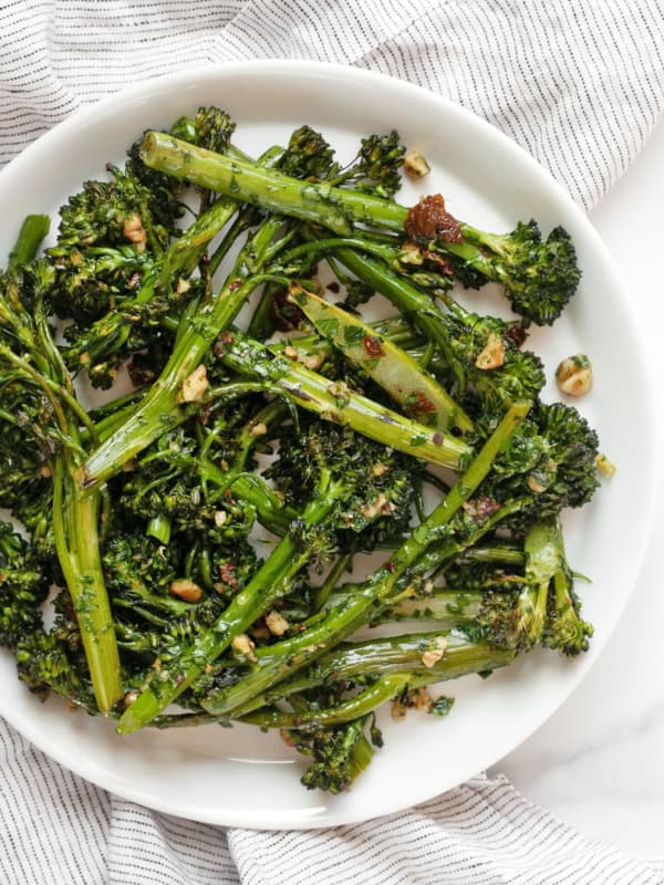 Roasted broccolini on a plate.