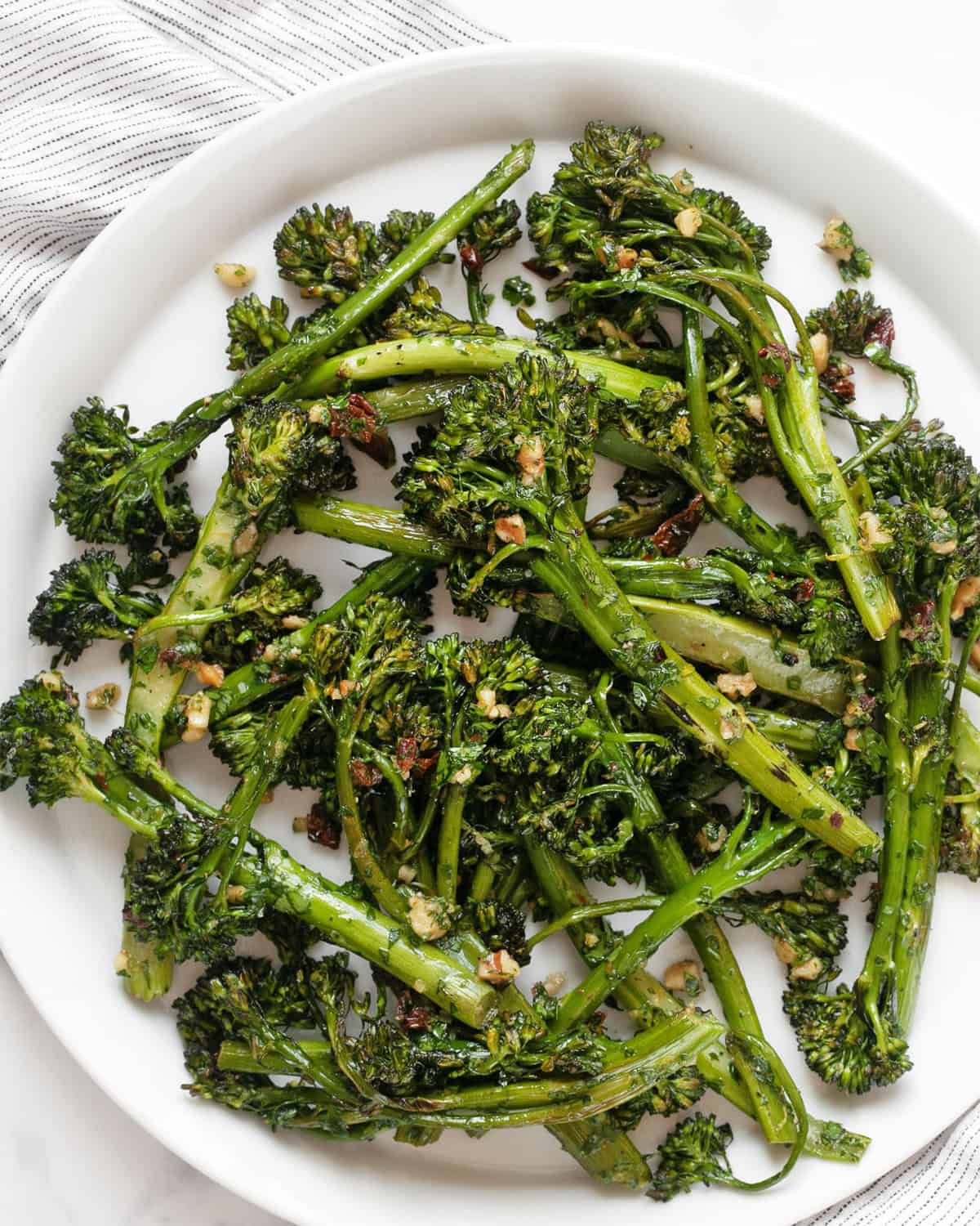 Roasted broccolini on a plate.