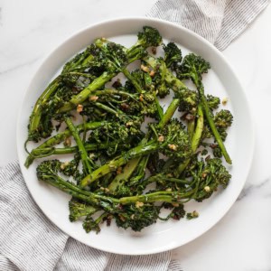 Roasted broccolini on a plate.